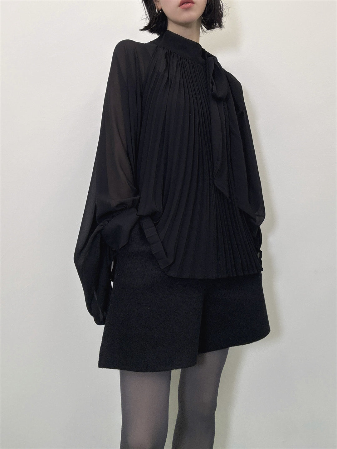 see-through pleated blouse