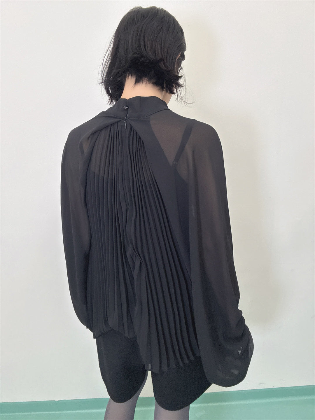 see-through pleated blouse