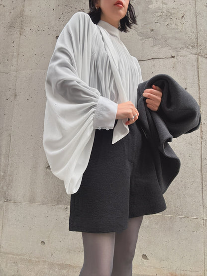 see-through pleated blouse