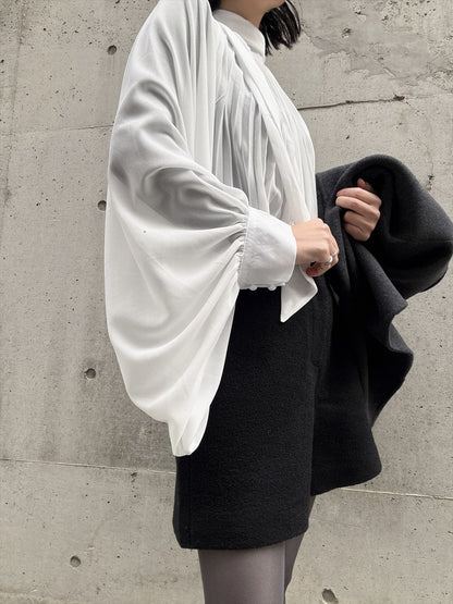 see-through pleated blouse