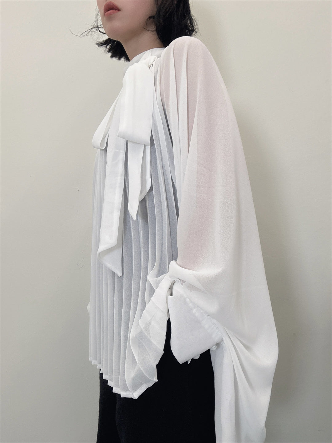 see-through pleated blouse