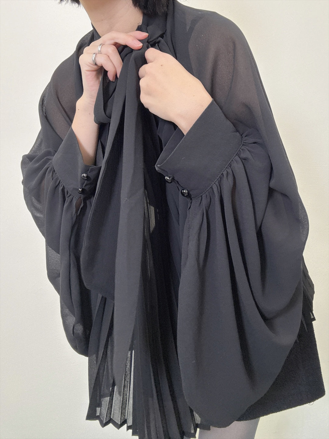 see-through pleated blouse