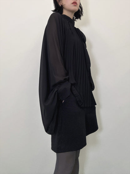 see-through pleated blouse