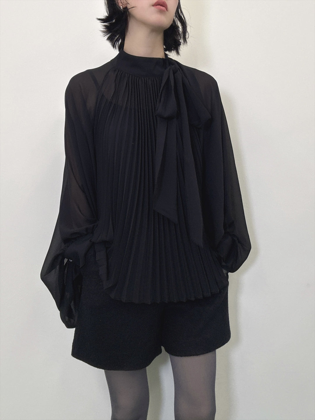 see-through pleated blouse
