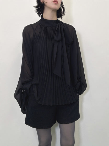 see-through pleated blouse