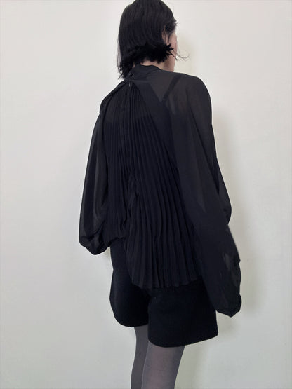 see-through pleated blouse