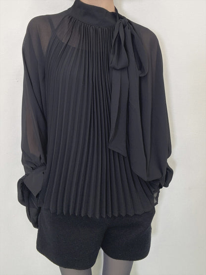 see-through pleated blouse