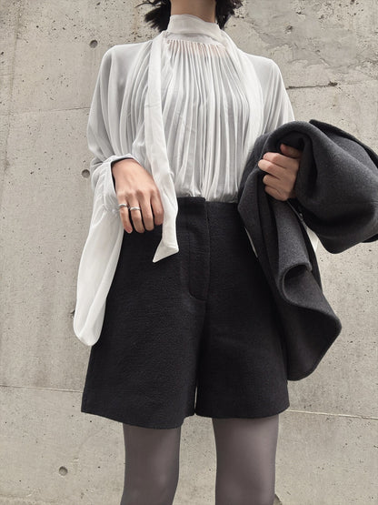 see-through pleated blouse