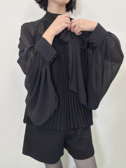 see-through pleated blouse